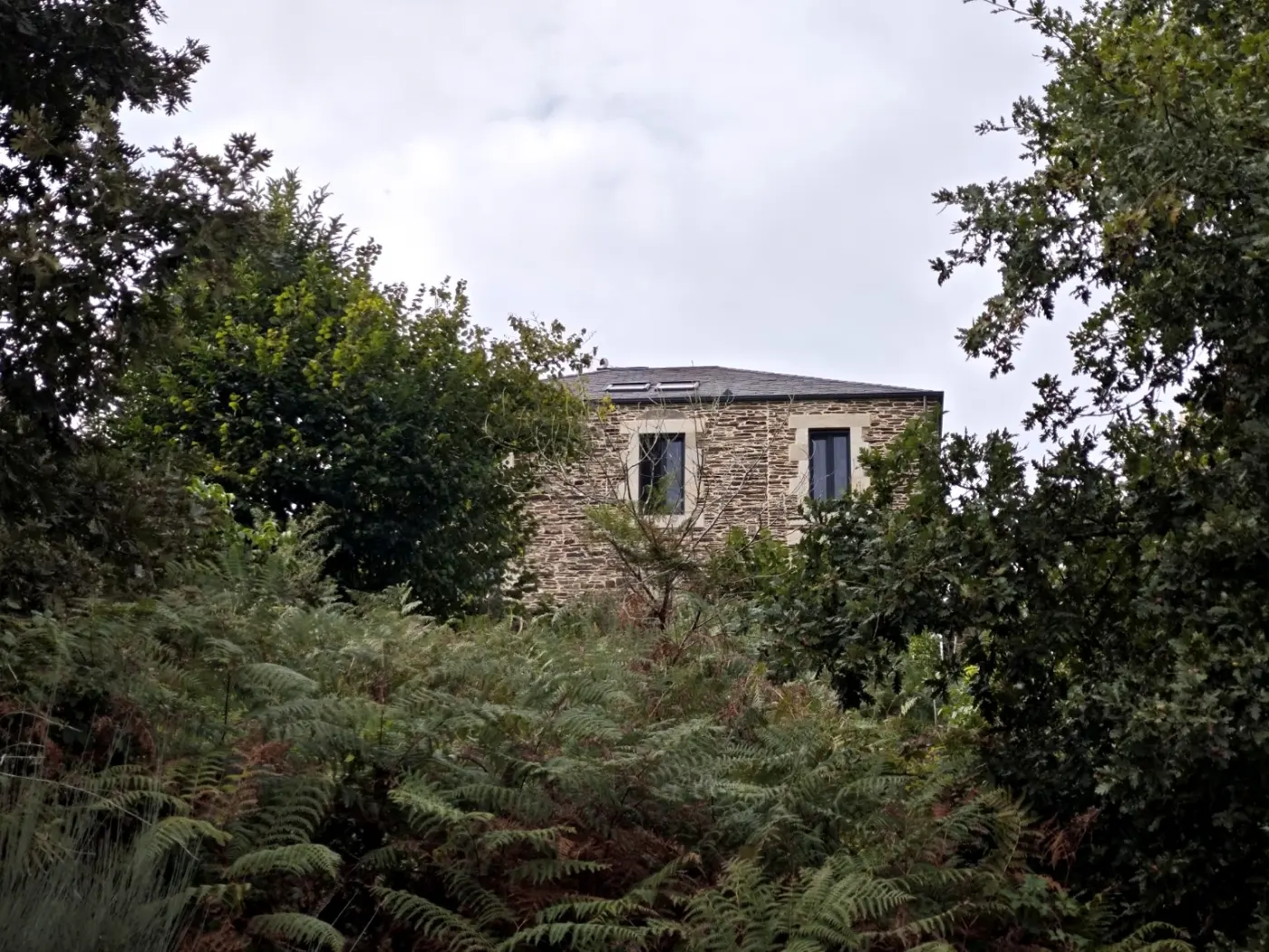 The stone house seen from the lower garden