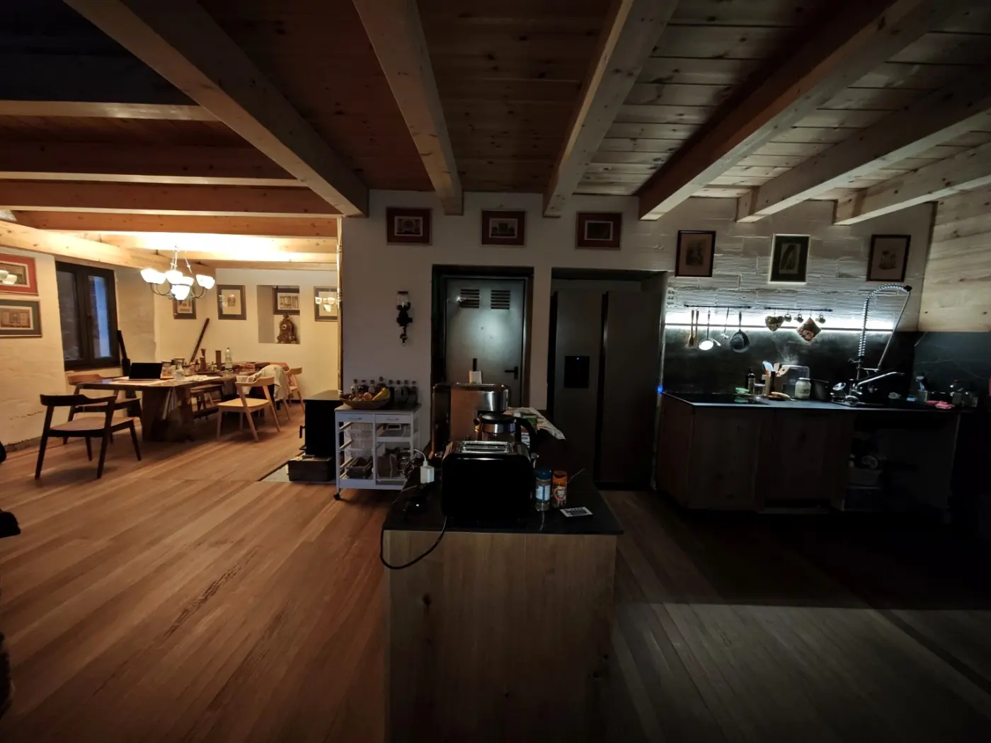 The 70 square metre kitchen and dining area under a timber ceiling