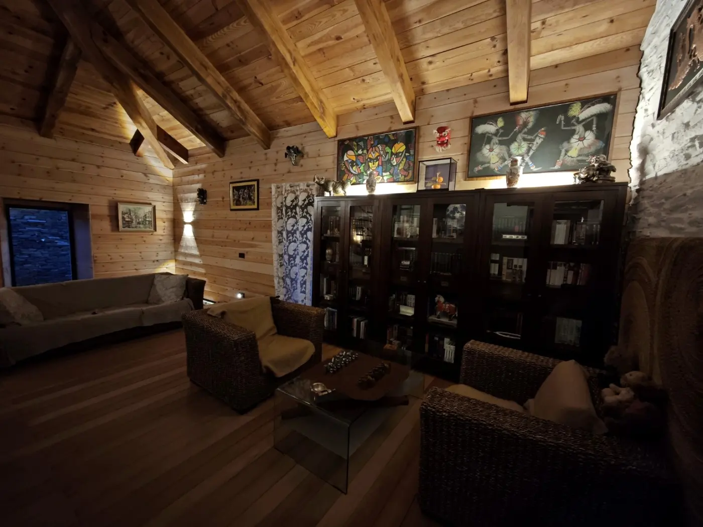 The upper sitting room, timber walls and bookcases