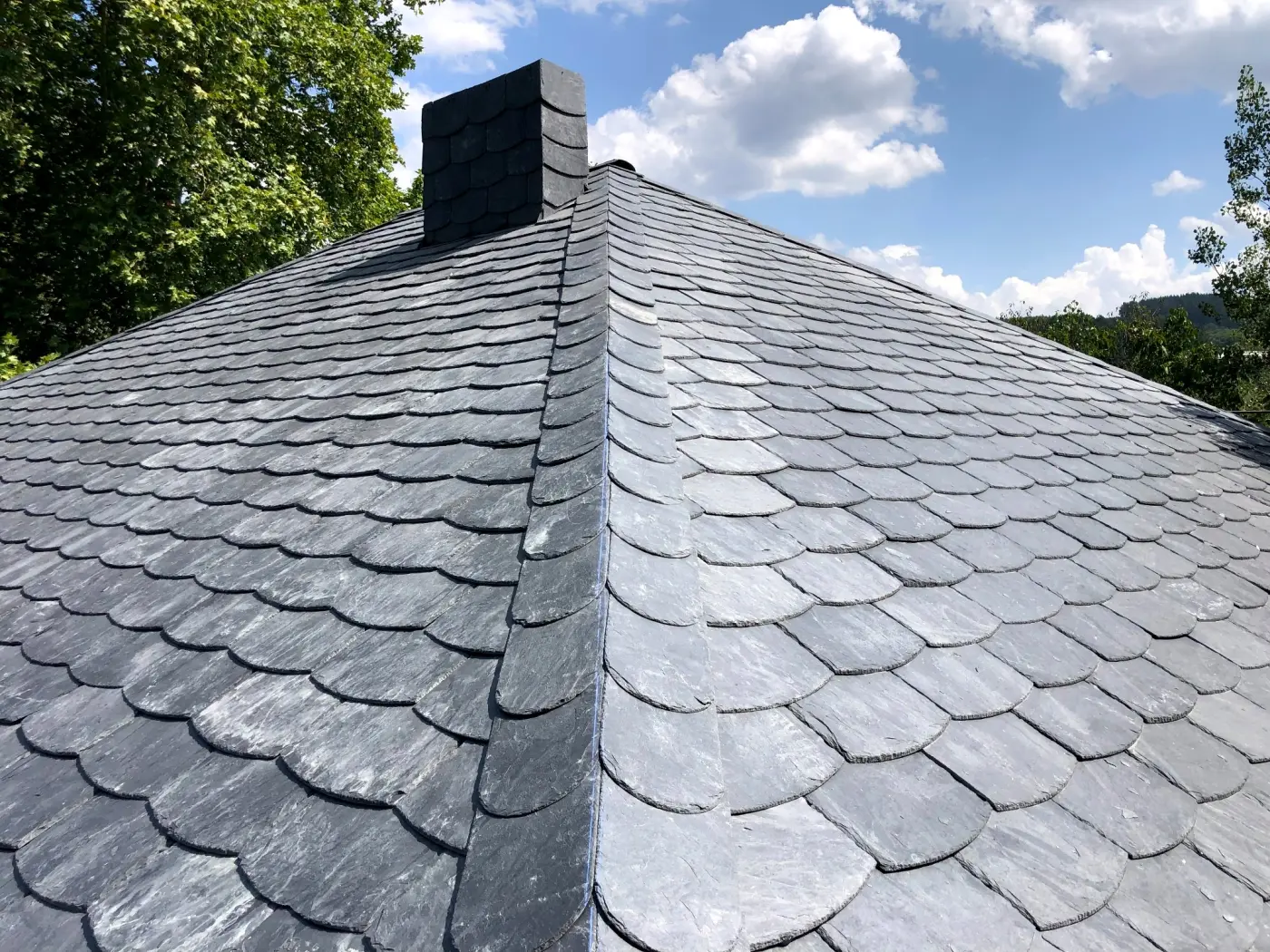 Hand-cut slate roof tiles
